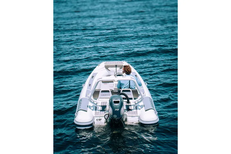 Slide: The Image of 2026 Highfield Sport 420 boat cruising on open water. - 8