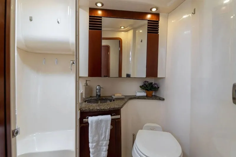 Slide: The Image of Luxurious bathroom in 2005 Sea Ray 420 Sedan Bridge yacht, featuring modern fixtures and elegant design. - 11