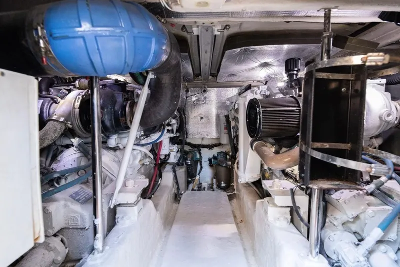 Slide: The Image of Engine room of 2005 Sea Ray 420 Sedan Bridge, showcasing mechanical components and systems. - 14