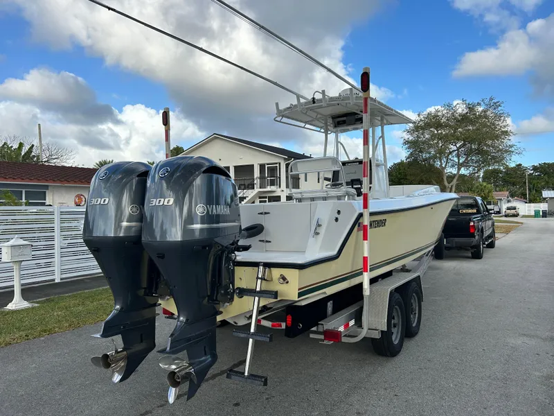 Slide: The Image of 2001 Contender 27' cuddy boat with twin Yamaha 300 engines on a trailer. - 14