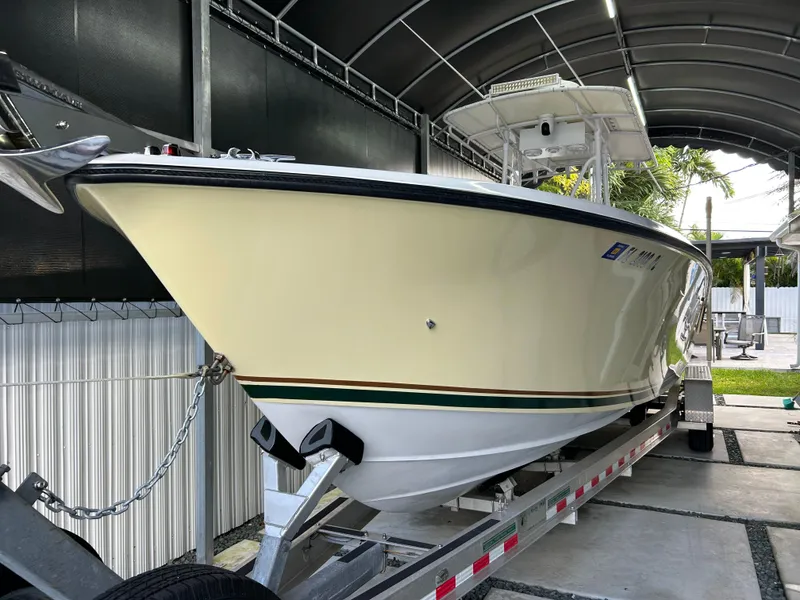Slide: The Image of 2001 Contender 27' cuddy boat on trailer in covered storage area. - 17