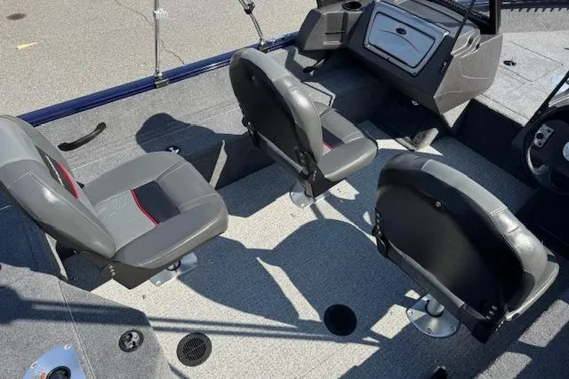 Slide: The Image of 2023 Tracker Pro Guide V-16 WT boat interior with gray seating and console. - 14