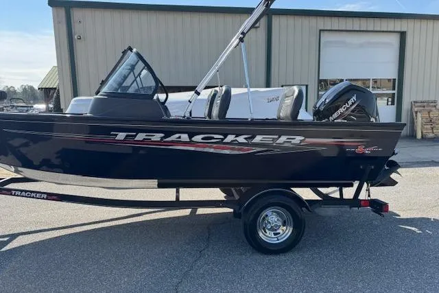 Slide: The Image of 2023 Tracker Pro Guide V-16 WT boat with Mercury engine on trailer. - 3