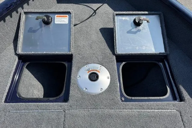 Slide: The Image of 2023 Tracker Pro Guide V-16 WT boat deck with storage compartments. - 8