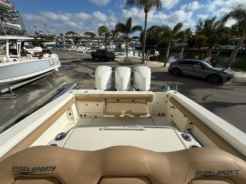 Slide: The Image of 2006 Hydra-Sports Vector 3300 CC boat with triple engines docked at marina. - 13