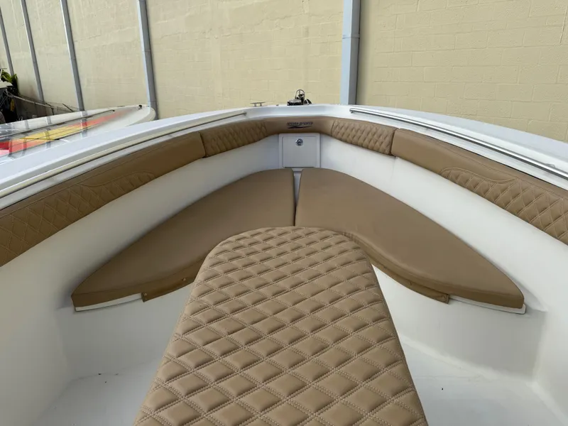 Slide: The Image of 2006 Hydra-Sports Vector 3300 CC boat interior with tan diamond-stitched seating. - 20