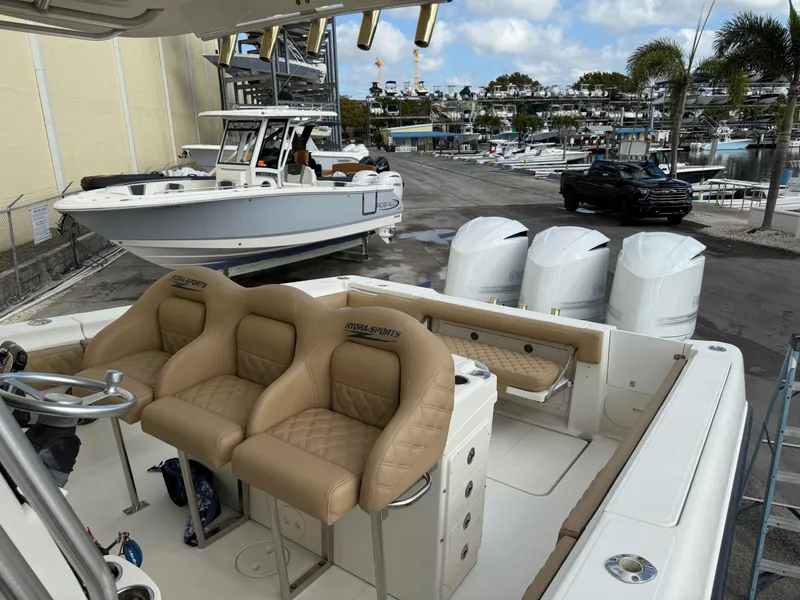 Slide: The Image of 2006 Hydra-Sports Vector 3300 CC boat with triple engines docked at marina. - 25