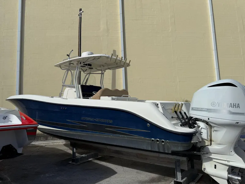 Slide: The Image of 2006 Hydra-Sports Vector 3300 CC boat with Yamaha outboard engine, docked indoors. - 30