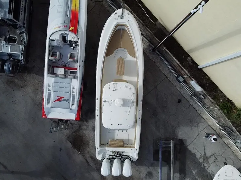 Slide: The Image of Aerial view of a 2006 Hydra-Sports Vector 3300 CC boat docked beside another vessel. - 5