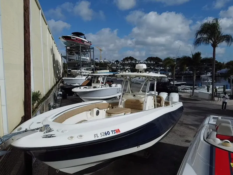 Slide: The Image of 2006 Hydra-Sports Vector 3300 CC boat docked at a marina under a blue sky. - 6