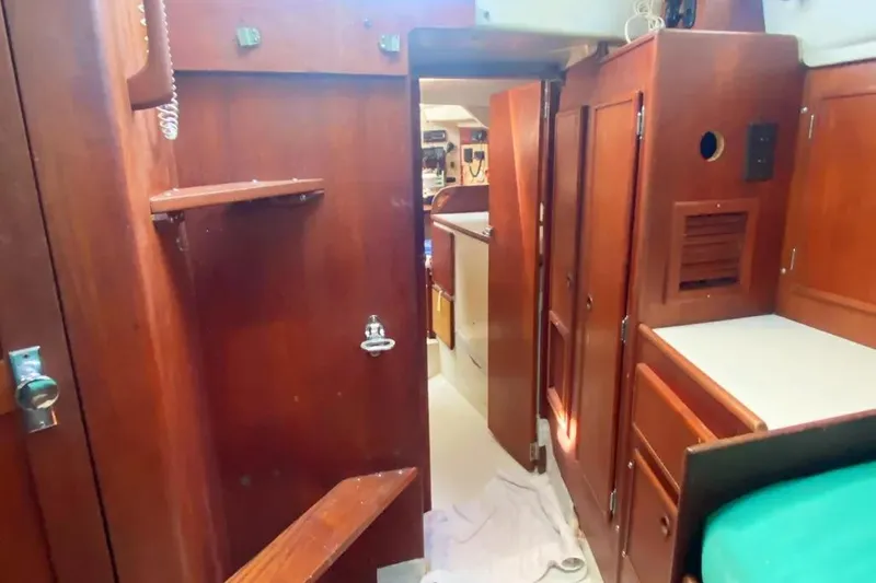 Slide: The Image of Interior of 1975 Whitby 42 Ketch sailboat with wooden cabinetry and cozy layout. - 29