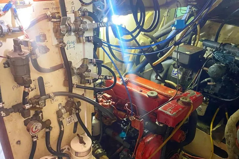 Slide: The Image of Engine room of a 1975 Whitby 42 Ketch with visible mechanical components. - 34