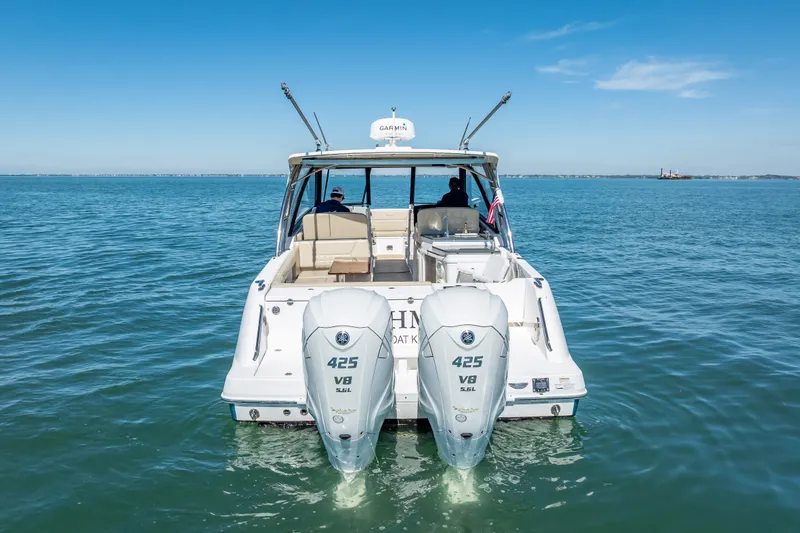 Slide: The Image of 2019 Everglades 340 Dual Console boat on open water, featuring twin 425 V8 engines. - 3