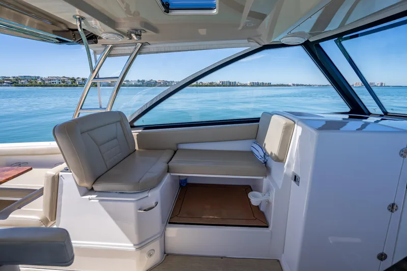 Slide: The Image of Interior of 2019 Everglades 340 Dual Console boat with seating and ocean view. - 35