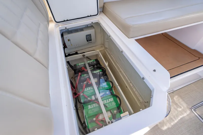 Slide: The Image of Battery compartment of 2019 Everglades 340 Dual Console boat, showcasing multiple batteries. - 41