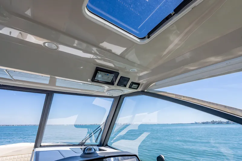 Slide: The Image of Interior view of 2019 Everglades 340 Dual Console boat with ocean backdrop. - 51