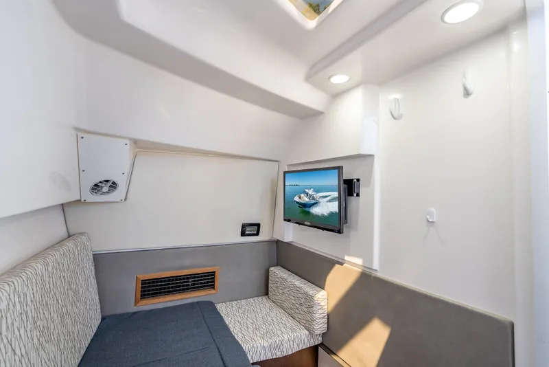Slide: The Image of Interior cabin of 2019 Everglades 340 Dual Console with TV and seating area. - 55