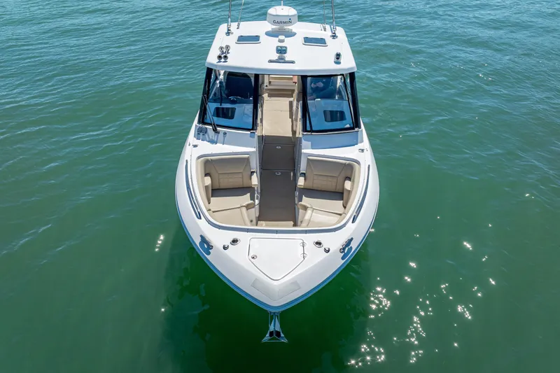 Slide: The Image of 2019 Everglades 340 Dual Console boat on clear water, aerial view. - 7