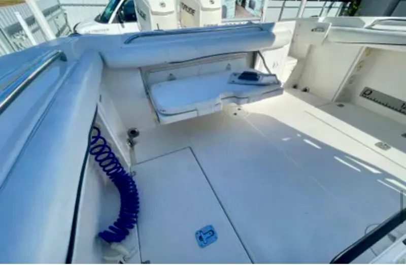 Slide: The Image of 2006 Wellcraft 32 CCF boat interior with seating and storage compartments. - 17