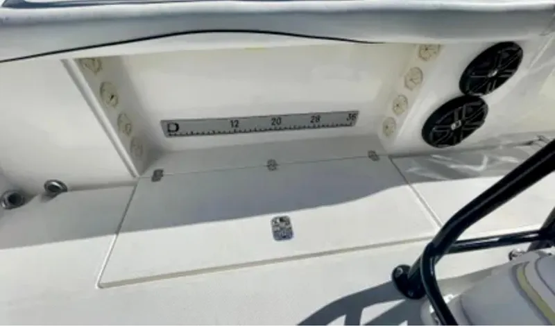 Slide: The Image of 2006 Wellcraft 32 CCF boat interior with measuring scale and speakers. - 30