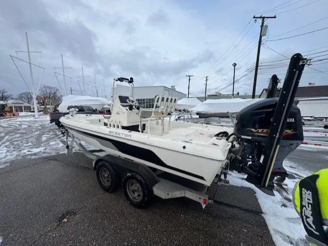 Slide: The Image of 2017 Skeeter ZX22 boat on trailer in snowy marina. - 2