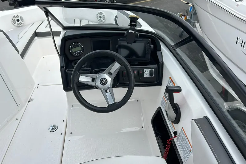Slide: The Image of 2019 Yamaha Boats AR190 cockpit with steering wheel and control panel. - 11