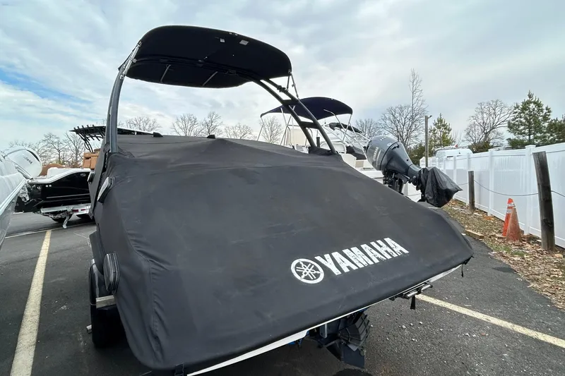 Slide: The Image of 2019 Yamaha AR190 boat with cover in parking lot. - 16