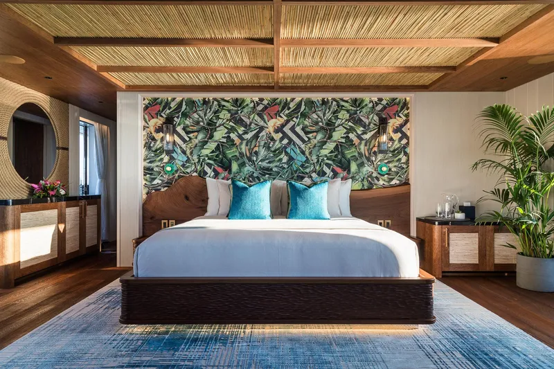 Slide: The Image of 2024 Dunya Yachts Explorer with slide, anchored in serene waters near a forested coastline. - 5