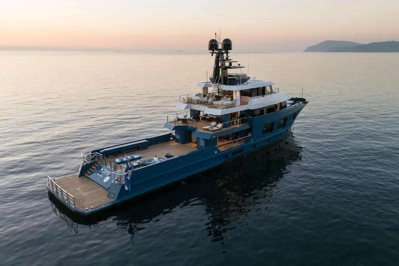 Slide: The Image of 2024 Dunya Yachts Explorer on serene ocean at sunset, showcasing luxury and elegance. - 14