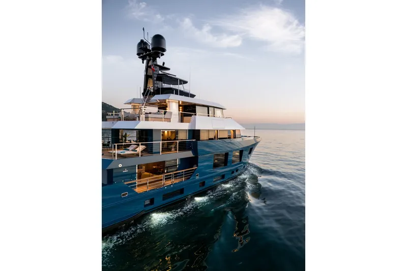 Slide: The Image of Luxurious 2024 Dunya Yachts Explorer cruising at sunset on calm waters. - 18