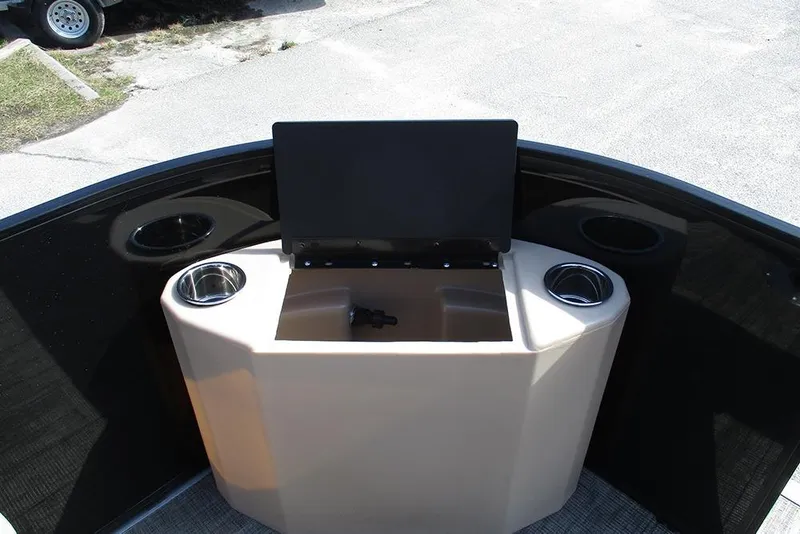 Slide: The Image of 2026 Bentley Pontoons Fish 200 FWD CW console with cup holders and storage. - 11
