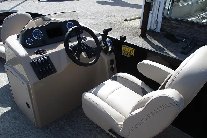 Slide: The Image of 2026 Bentley Pontoons Fish 200 FWD CW interior with steering console and captain's chair. - 23