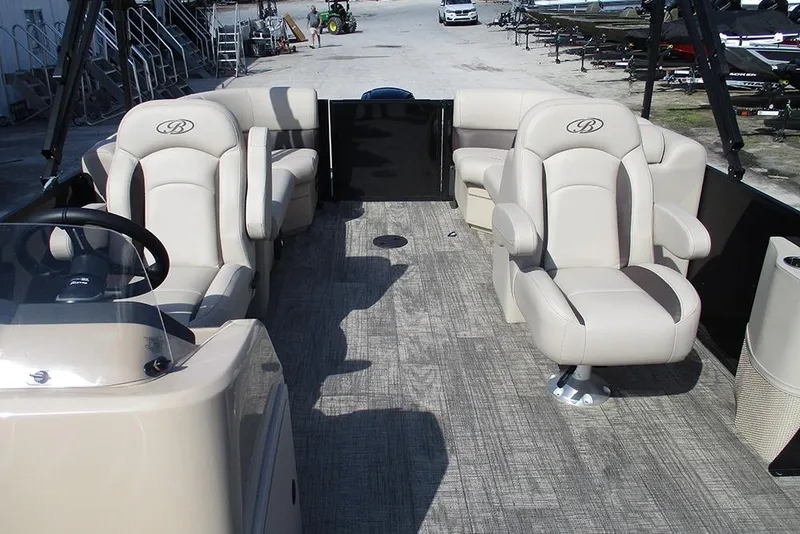 Slide: The Image of 2026 Bentley Pontoons Fish 200 FWD CW interior with luxurious seating and steering console. - 8