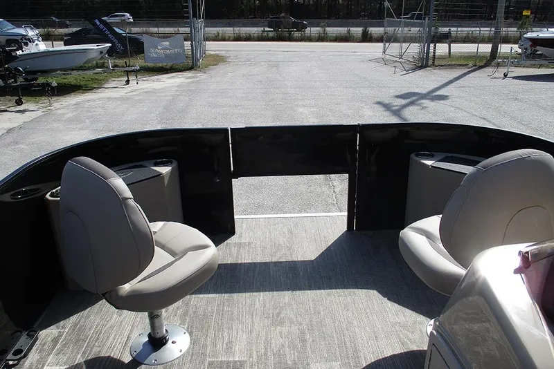 Slide: The Image of 2026 Bentley Pontoons Fish 200 FWD CW interior with two swivel seats and open deck. - 9