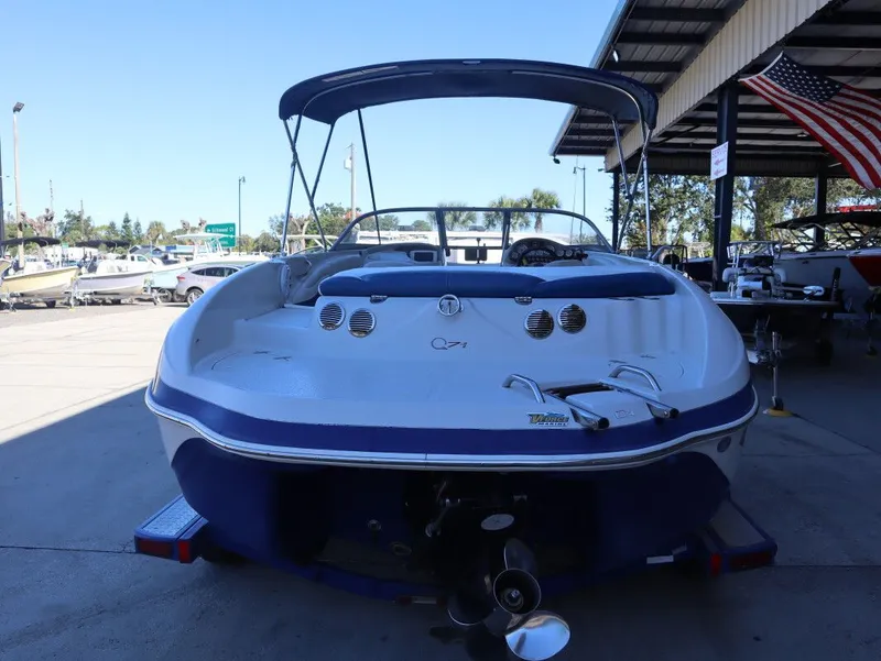 Slide: The Image of Rear view of a 2010 Tahoe Q71 21 boat at the dock. - 3