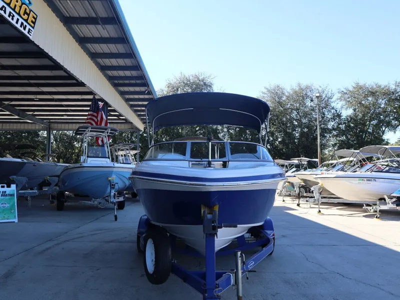 Slide: The Image of 2010 Tahoe Q71 21 boat on trailer outdoors. - 4