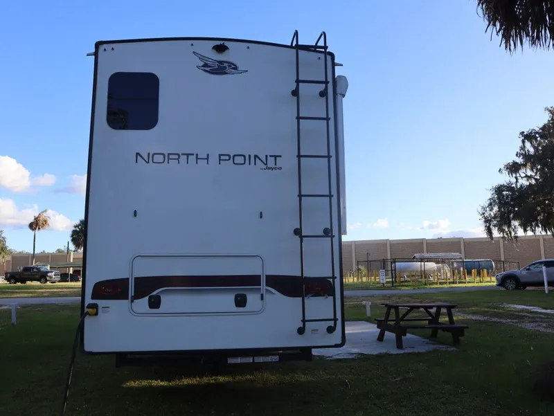 Slide: The Image of Rear view of a 2023 JAYCO North Point 382FLRB RV. - 13