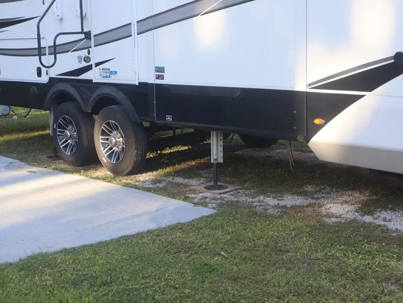 Slide: The Image of 2023 JAYCO North Point 382FLRB RV parked on grass. - 14