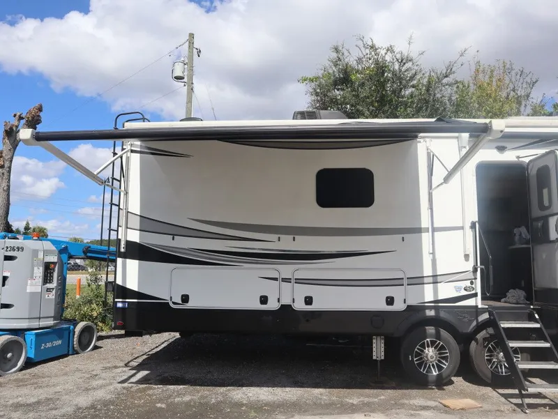 Slide: The Image of 2023 JAYCO North Point RV with extended awning. - 21