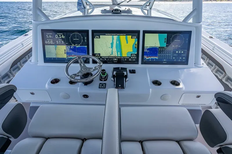 Slide: The Image of 2024 Yellowfin 54 Offshore helm with advanced navigation displays and controls. - 23