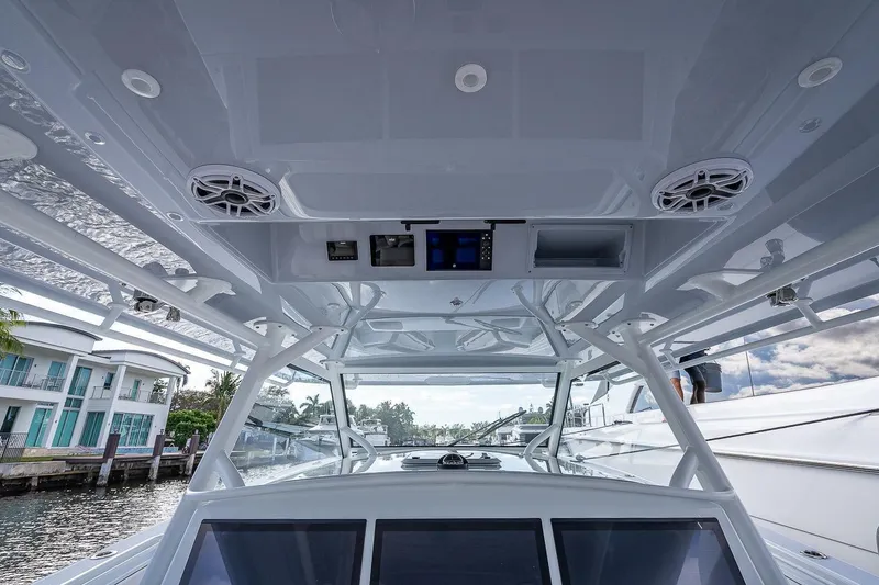 Slide: The Image of 2024 Yellowfin 54 Offshore boat interior with modern electronics and sleek design. - 30