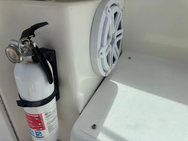 Slide: The Image of Fire extinguisher and speaker on 2004 Sea Ray 340 Sundancer boat interior. - 22