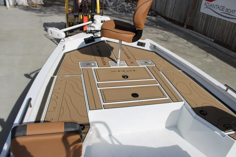 Slide: The Image of 2026 Xpress XR21B Bay boat deck with seating and storage compartments. - 10