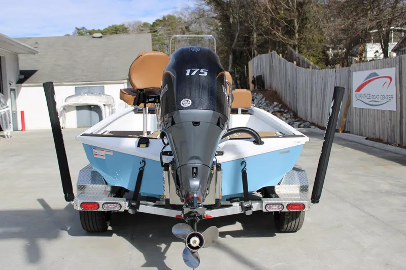 Slide: The Image of 2026 Xpress XR21B Bay boat with 175 HP engine on trailer at dealership. - 3