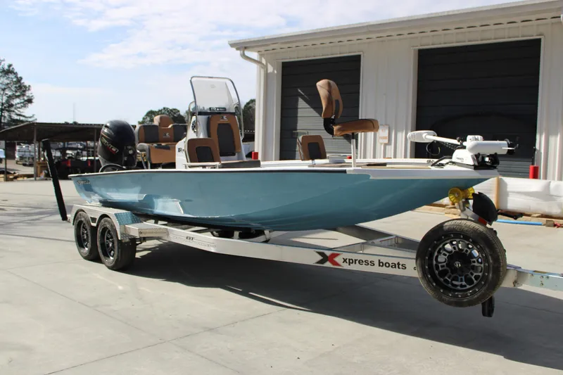 Slide: The Image of 2026 Xpress XR21B Bay boat on trailer, parked outdoors. - 5