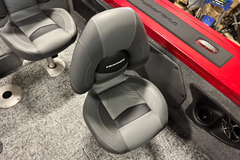 Slide: The Image of 2026 Tracker Targa V-19 WT boat interior with gray seats and red trim. - 10