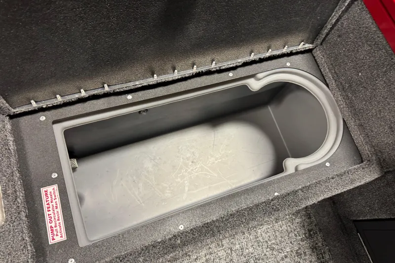 Slide: The Image of Storage compartment in 2026 Tracker Targa V-19 WT boat, featuring a pump-out feature. - 12