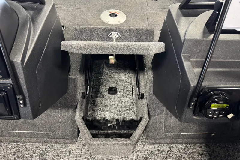 Slide: The Image of 2026 Tracker Targa V-19 WT boat interior storage compartment with carpeted finish. - 15