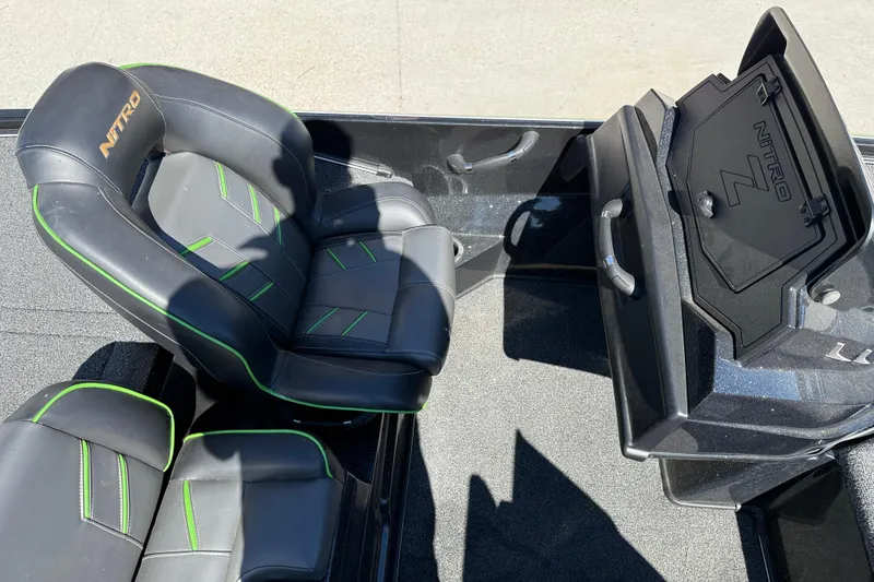 Slide: The Image of Nitro Z20 2020 boat interior with black and green seats and storage compartment. - 14
