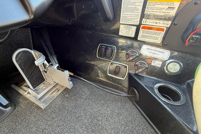 Slide: The Image of Interior controls of a 2020 Nitro Z20 boat, featuring foot pedal and switches. - 17